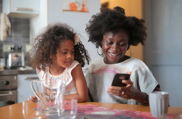 Mother and daughter at the kitchen table - life insurance