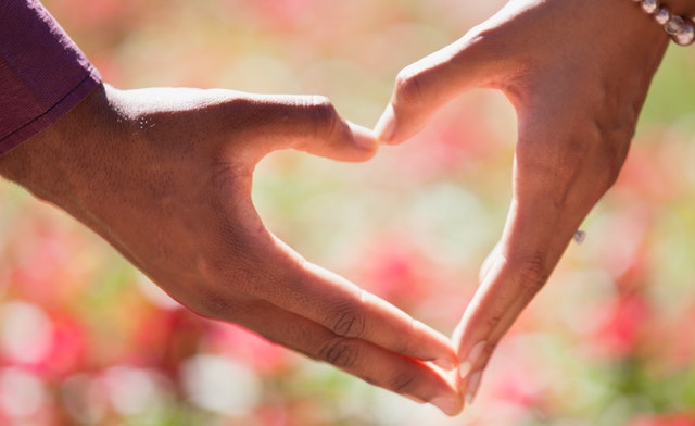 Heart made out of two hands coming together - Family Life Insurance